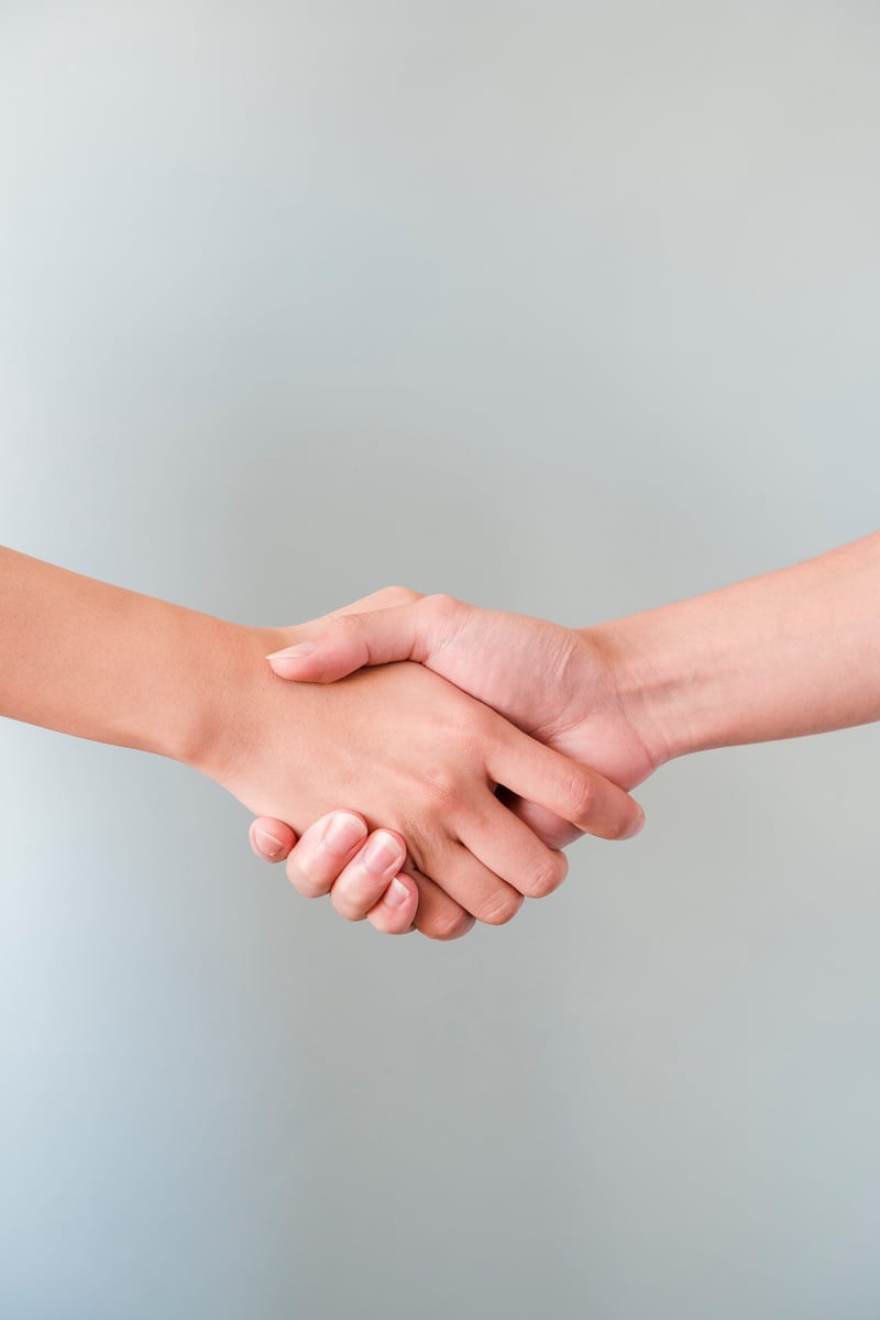 Photo of People Shaking Hands